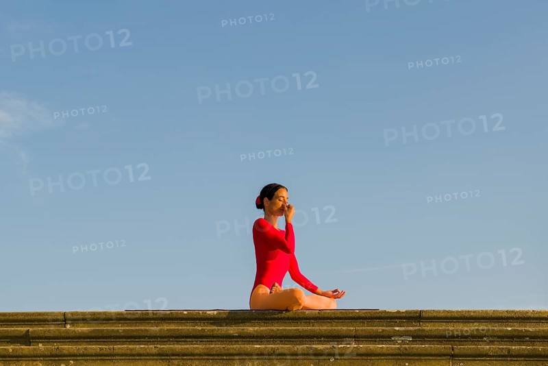 Young woman practising Hatha yoga