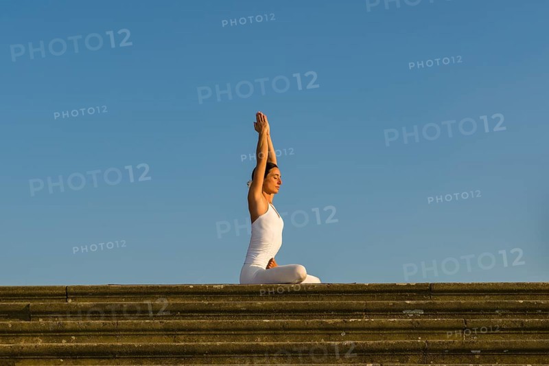 Young woman practising Hatha yoga