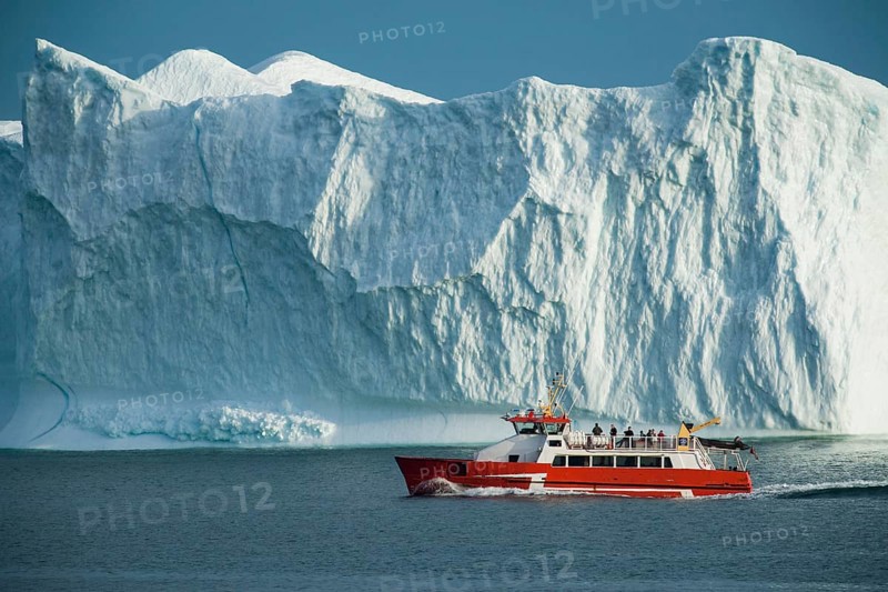 Disko Line ferry passing iceberg