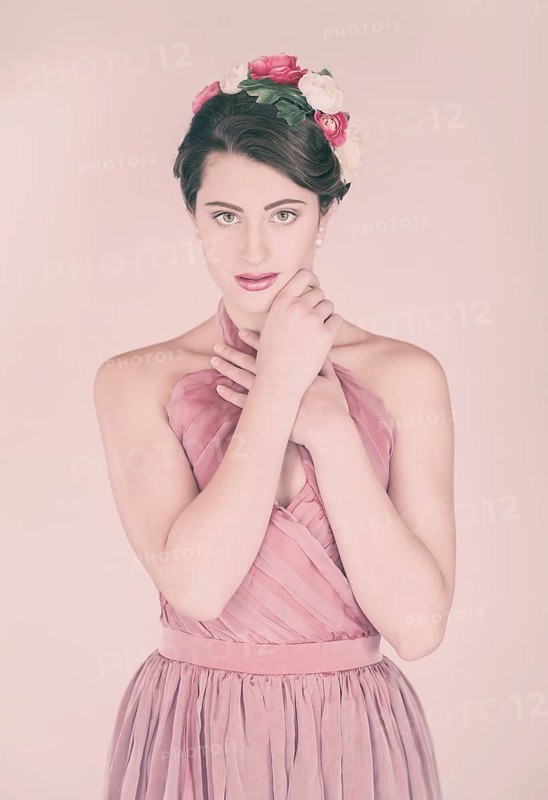 Beauty portrait of a young woman with flowers in her hair