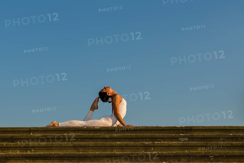 Young woman practising Hatha yoga