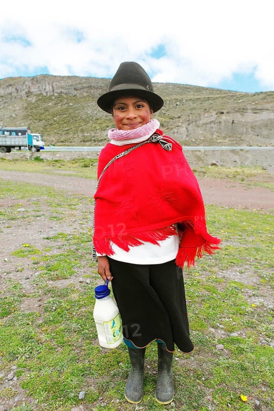 Girl in traditional costume with milk jug