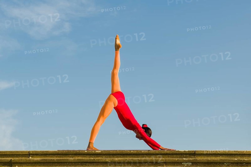 Young woman practising Hatha yoga
