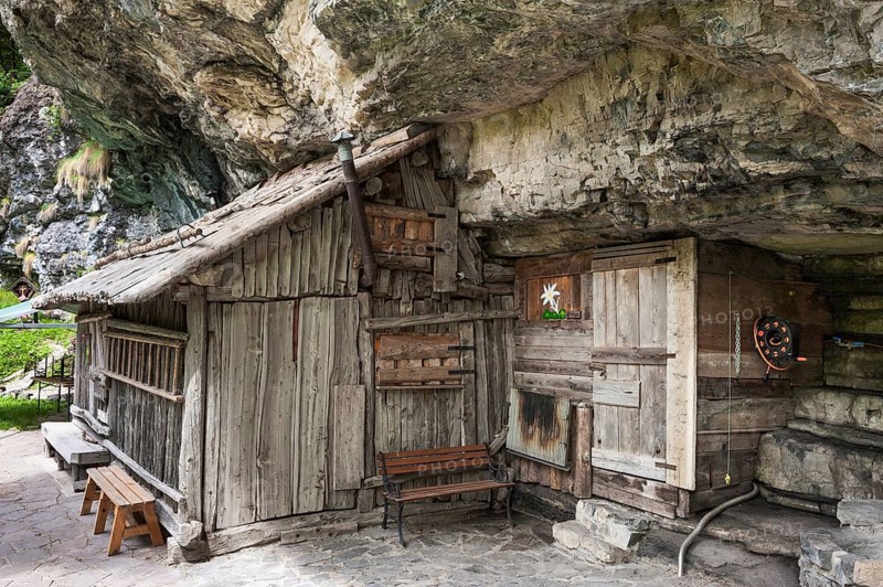 Wooden hut with cliffs