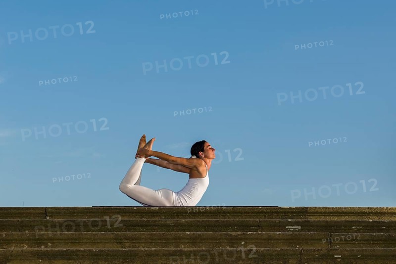 Young woman practising Hatha yoga