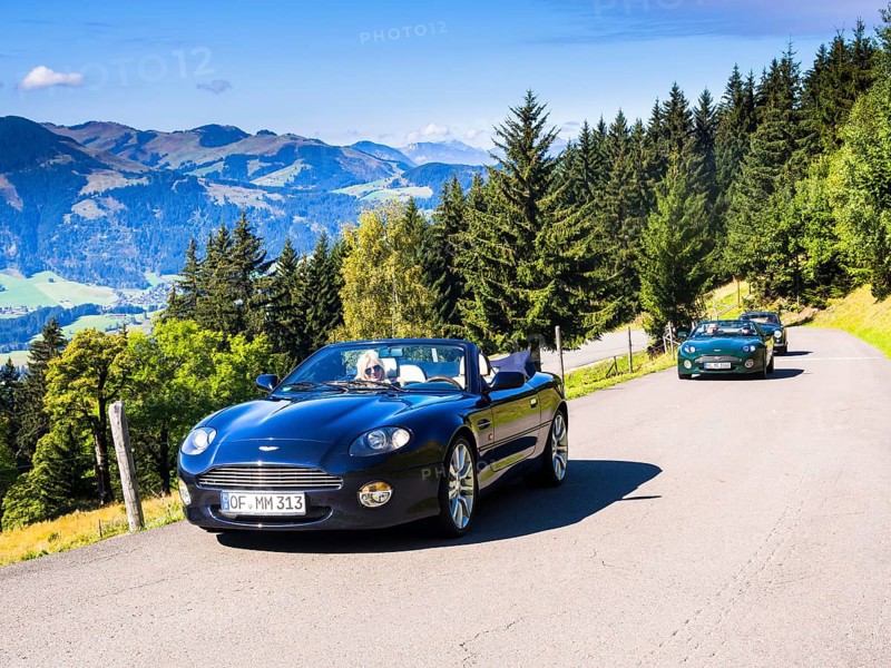 Aston Martin DB7 Vantage Volange cars on a mountain road near Kitzbuhel