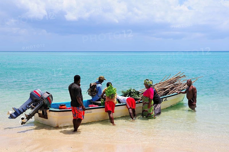 Boat being loaded on the beach of Ilots Choizil