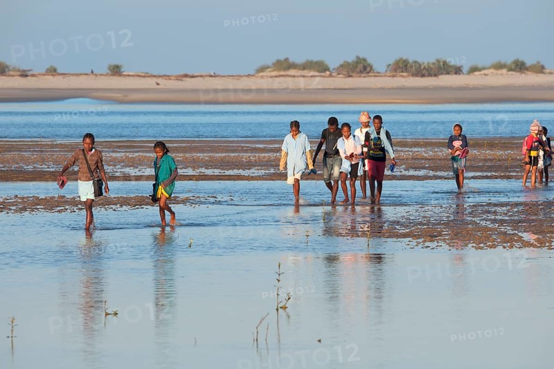 Malagasy people crossing the water