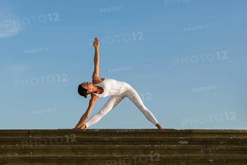 Young woman practising Hatha yoga