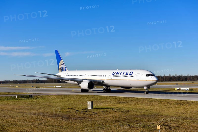 United Airlines Boeing B 767 rolling on the taxiway towards runway