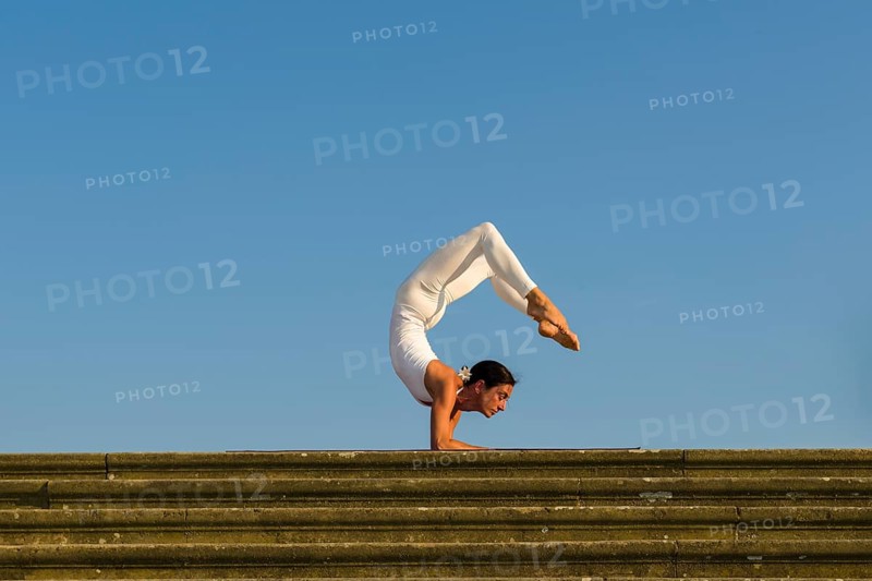 Young woman practising Hatha yoga