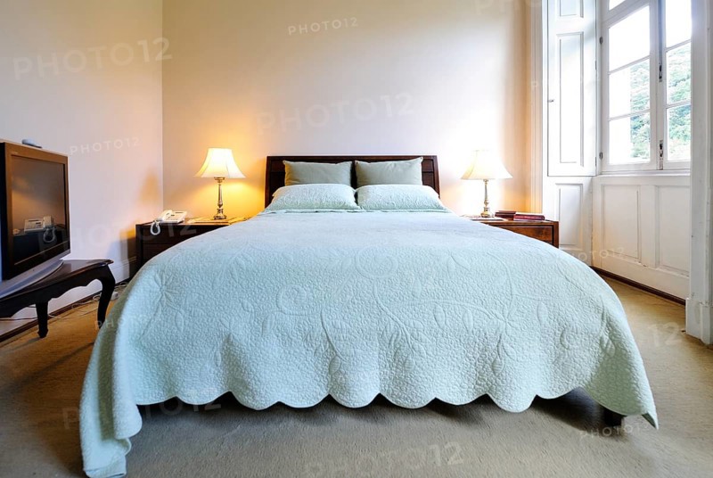 Double bed in a bedroom