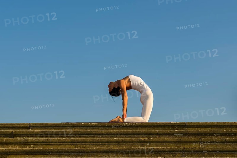 Young woman practising Hatha yoga