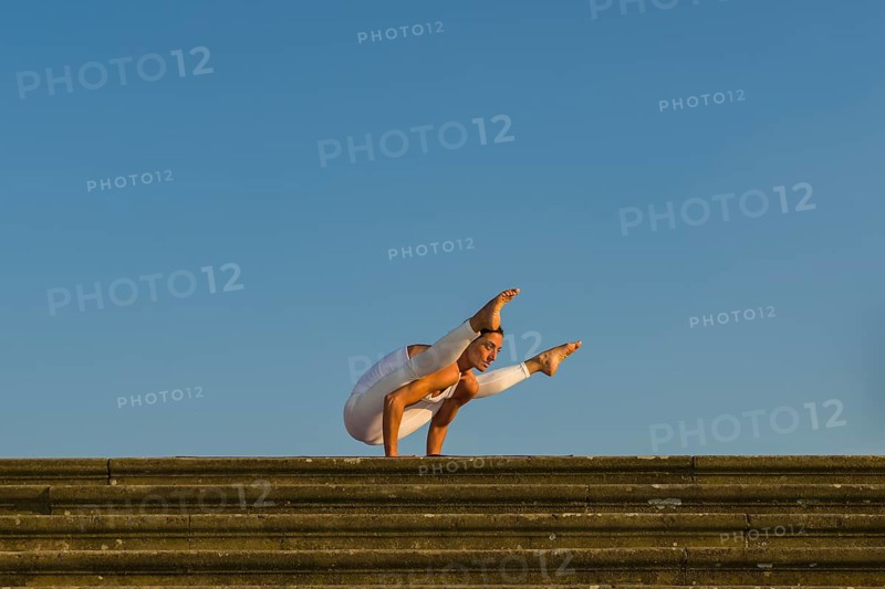 Young woman practising Hatha yoga