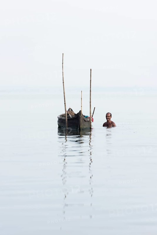 Cockle picker at his boat