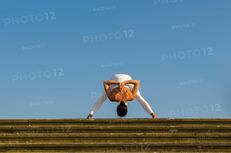 Young woman practising Hatha yoga