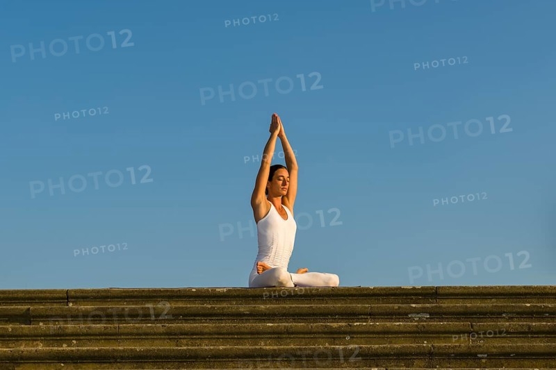 Young woman practising Hatha yoga