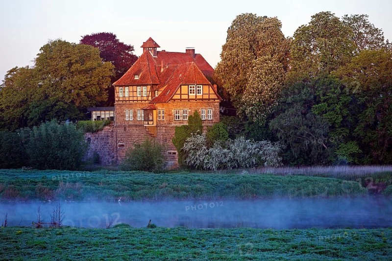 Petershagen Castle on the River Weser at sunrise
