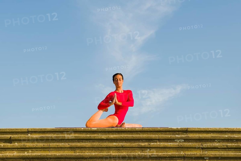 Young woman practising Hatha yoga