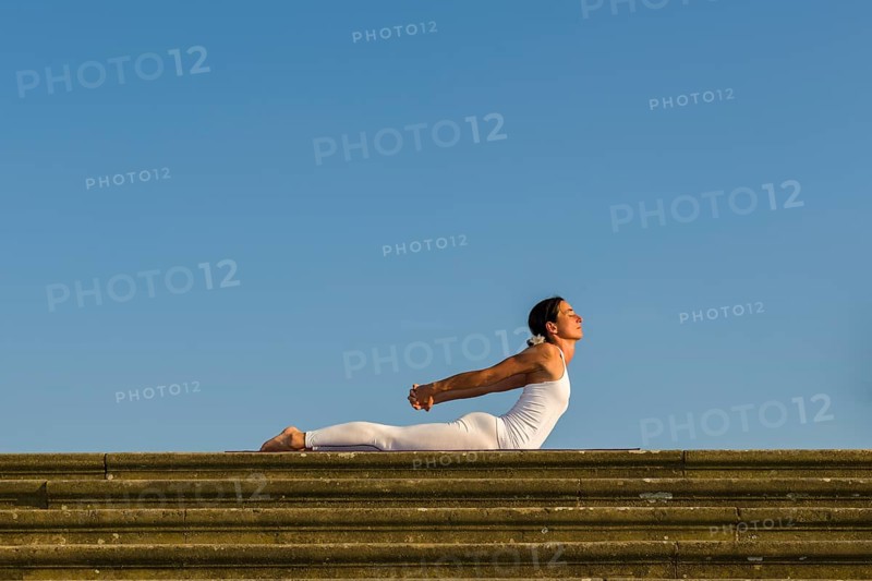 Young woman practising Hatha yoga