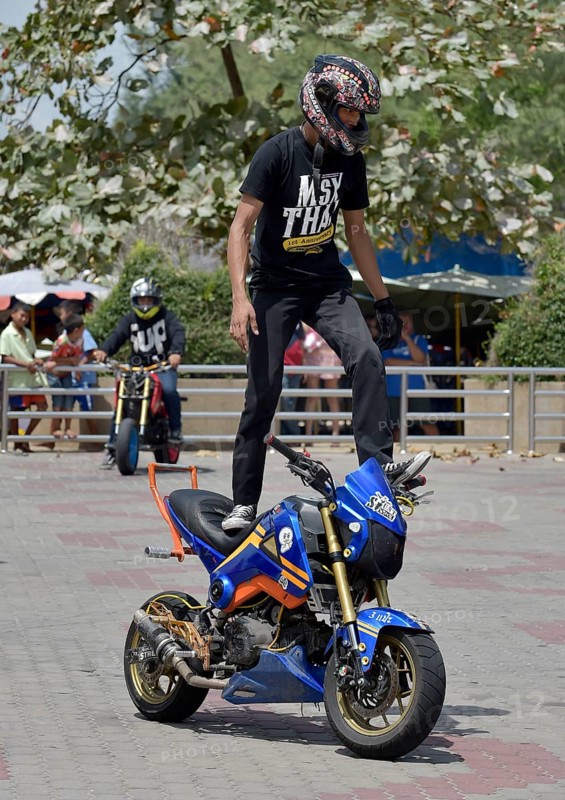 Motorcycle stunt rider performing