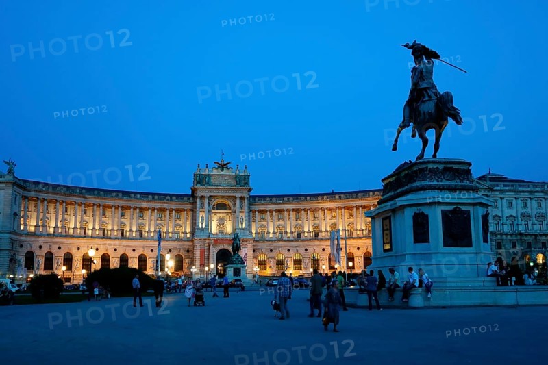 Hofburg Palace at Heldenplatz square with the equestrian monument of Archduke Charles