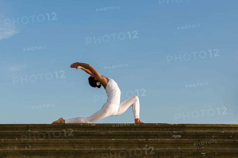 Young woman practising Hatha yoga