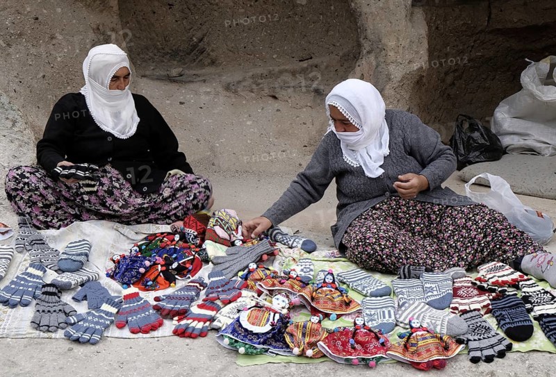 Women offering handicrafts