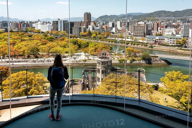 Woman looking from observation platform of Hiroshima Orizuru Tower
