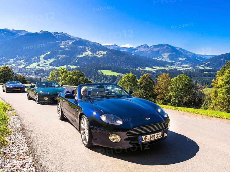Aston Martin DB7 Vantage Volange cars on a mountain road near Kitzbuhel