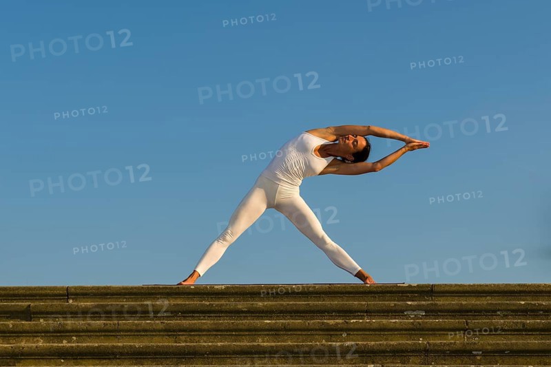 Young woman practising Hatha yoga