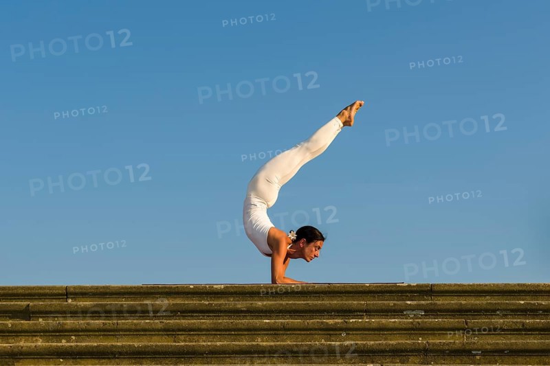 Young woman practising Hatha yoga
