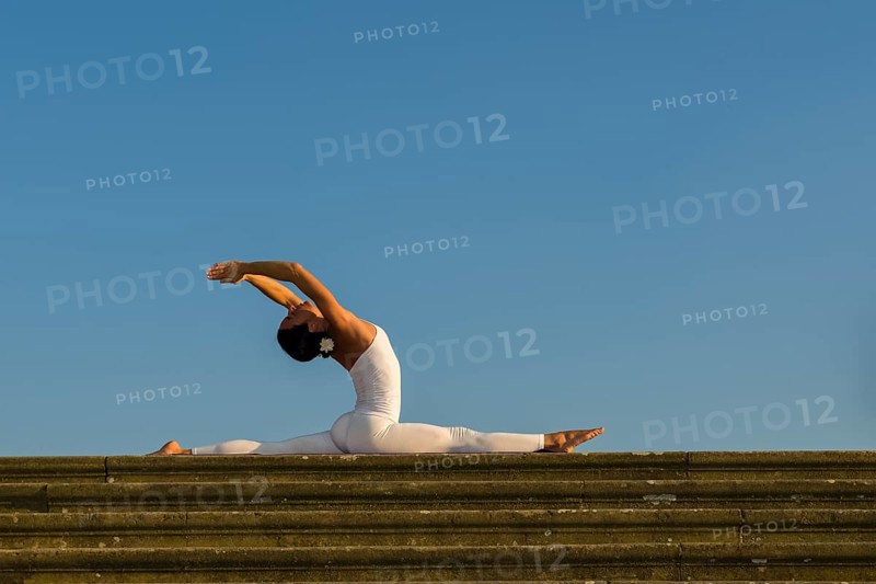 Young woman practising Hatha yoga