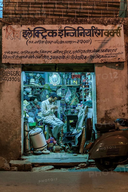 Electronics retailer in his workshop in the evening