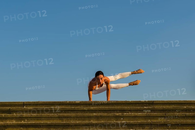 Young woman practising Hatha yoga