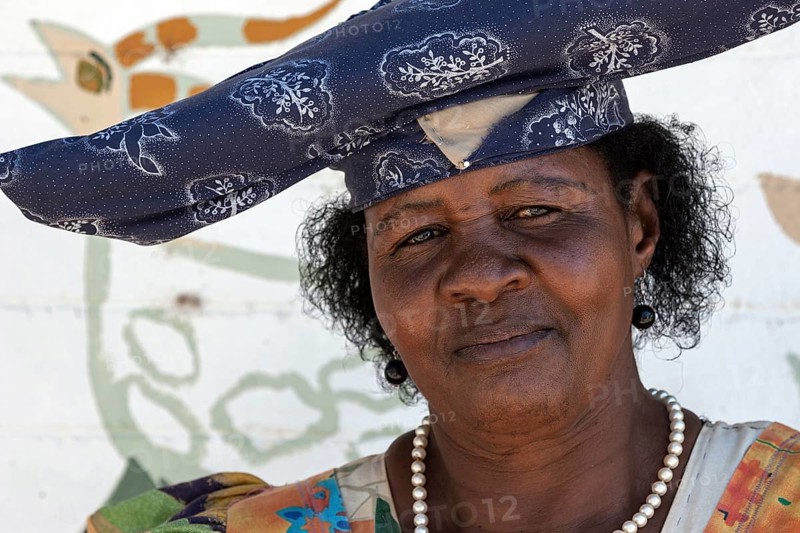 Local Herero woman wearing typical headdress and dress