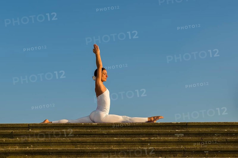 Young woman practising Hatha yoga