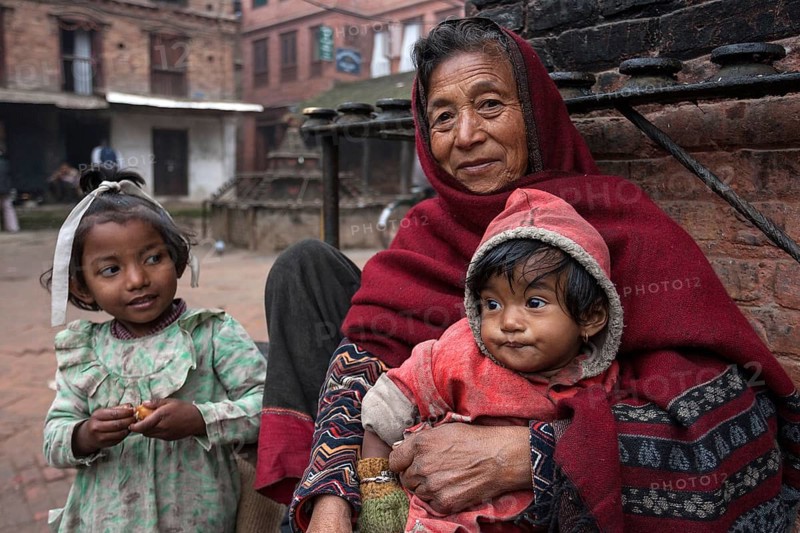 Elderly Nepalese woman with two children