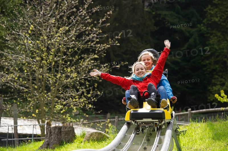 Young women on a summer toboggan run