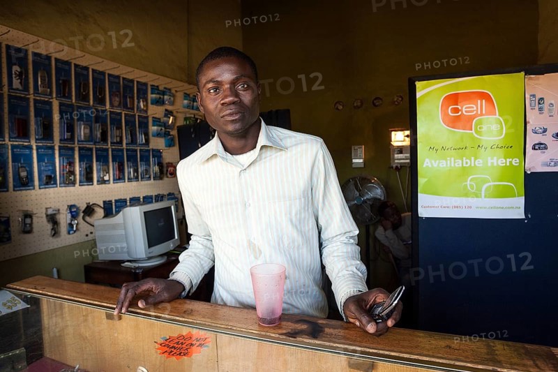 Local salesman in a small shop