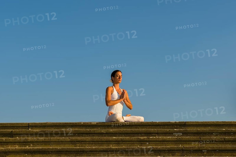 Young woman practising Hatha yoga