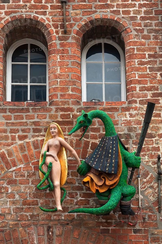 Figures of a dragon and a woman on the facade of the former Hieronymus Restaurant & Cafe