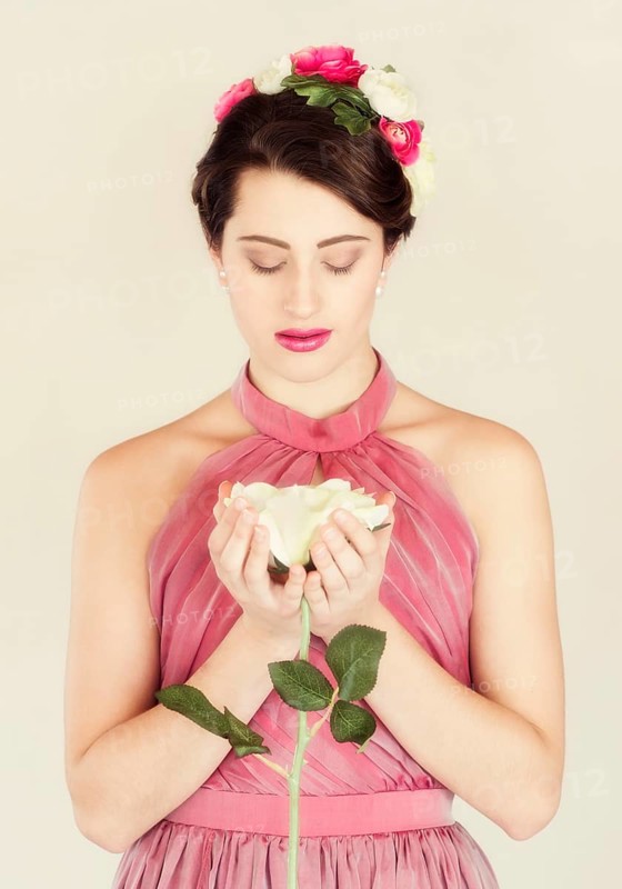 Beauty portrait of a young woman with flowers in her hair