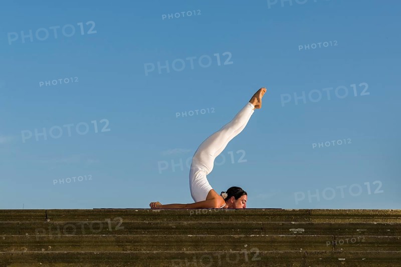 Young woman practising Hatha yoga