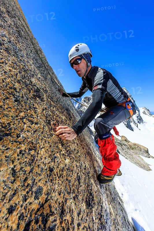 Climber climbing on a rock wall