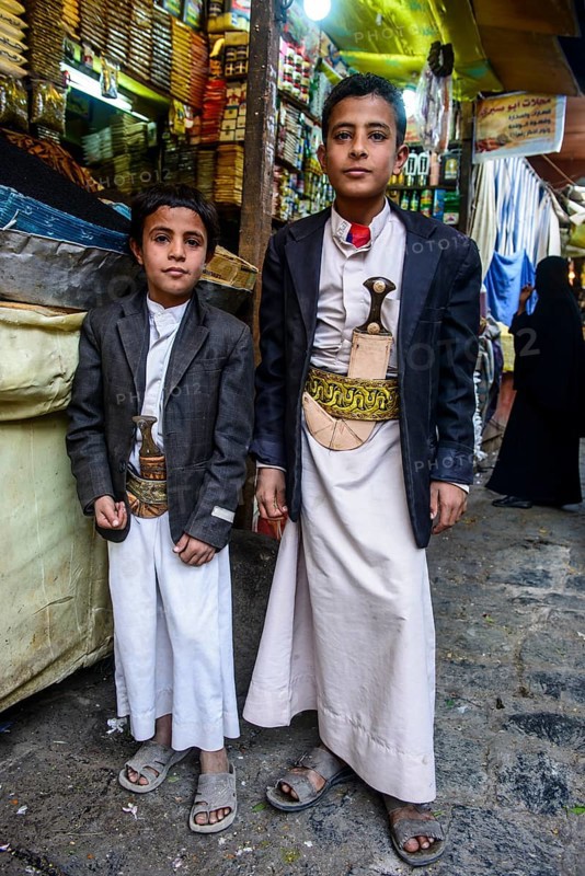Two boys with their djambas at the spice market in the old city