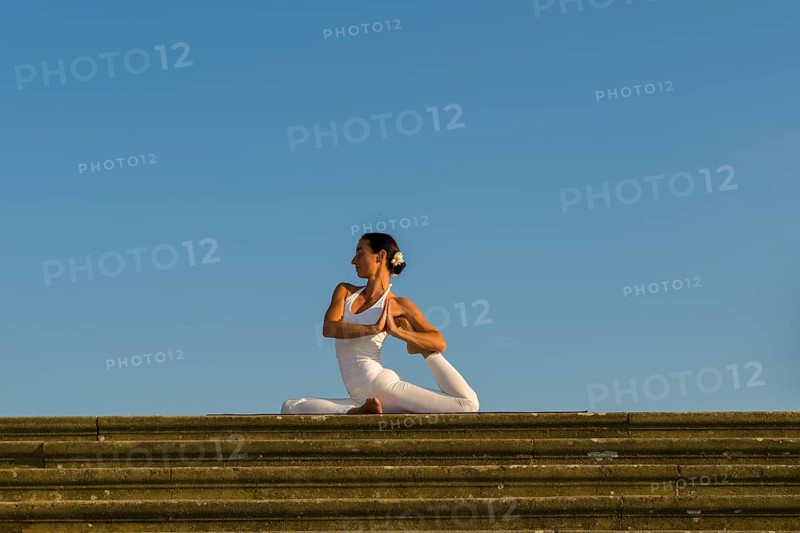 Young woman practising Hatha yoga