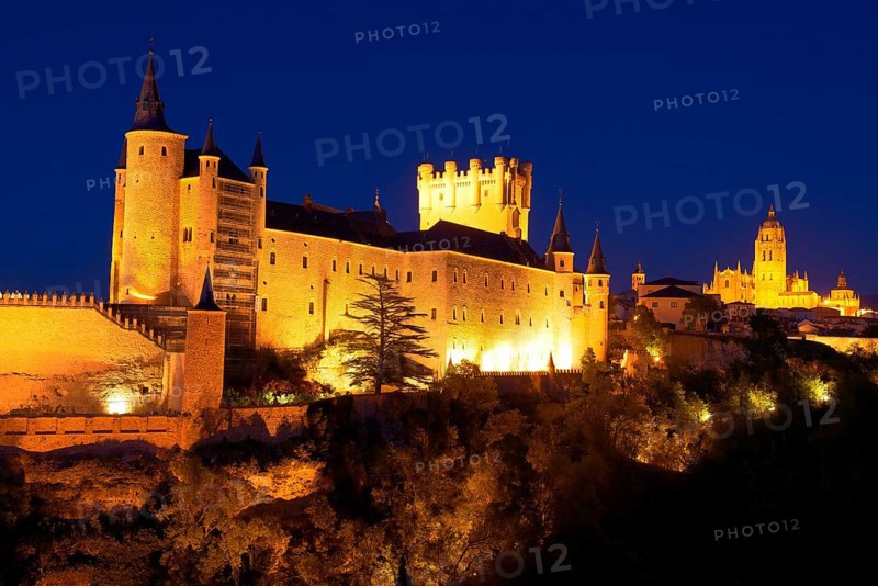 Alcazar fortress and cathedral at dusk