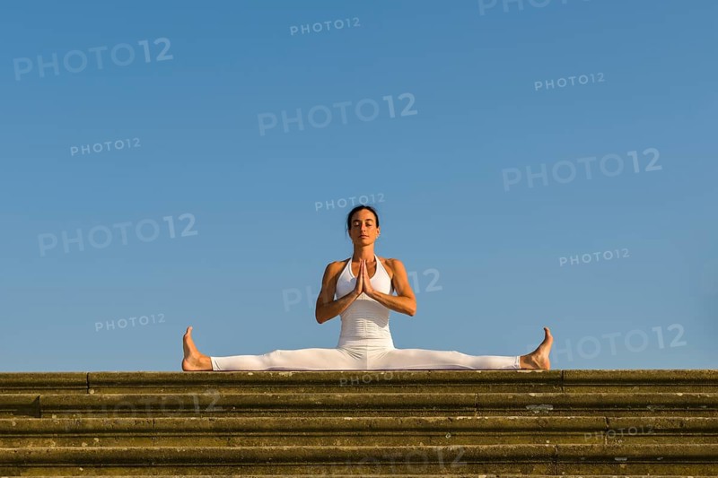 Young woman practising Hatha yoga