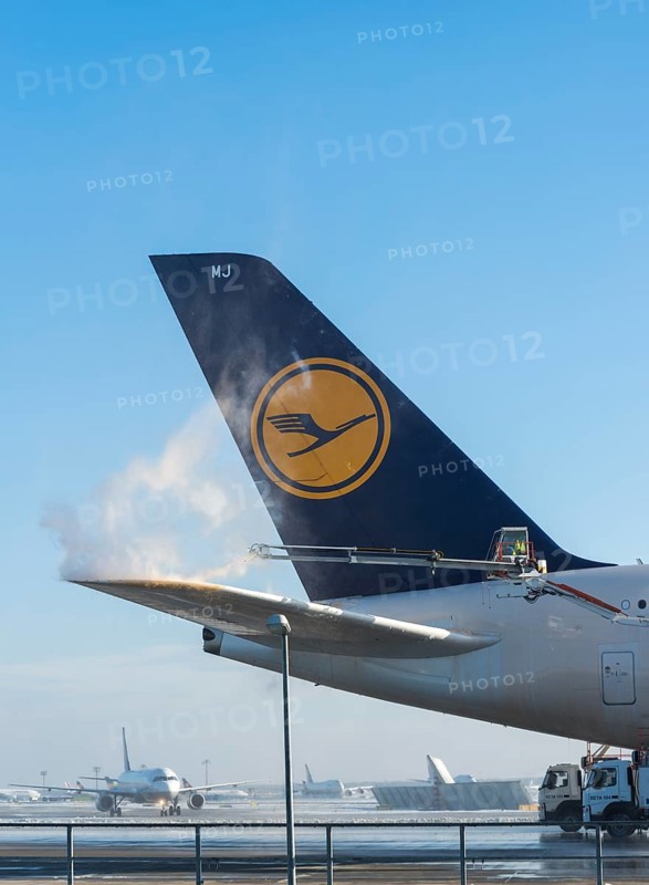 Tail fin of a Lufthansa Airbus A380-841 during deicing at Frankfurt Airport